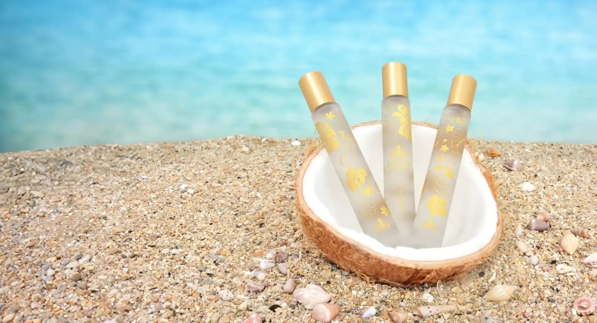 Glass bottles filled with liquid standing in a coconut shell bowl.